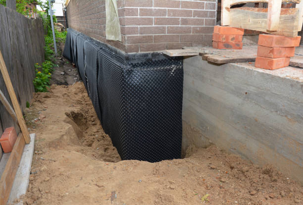 SJ Waterproofing Pros technician performing targeted Basement Waterproofing assessment in Pleasant Ridge, MI